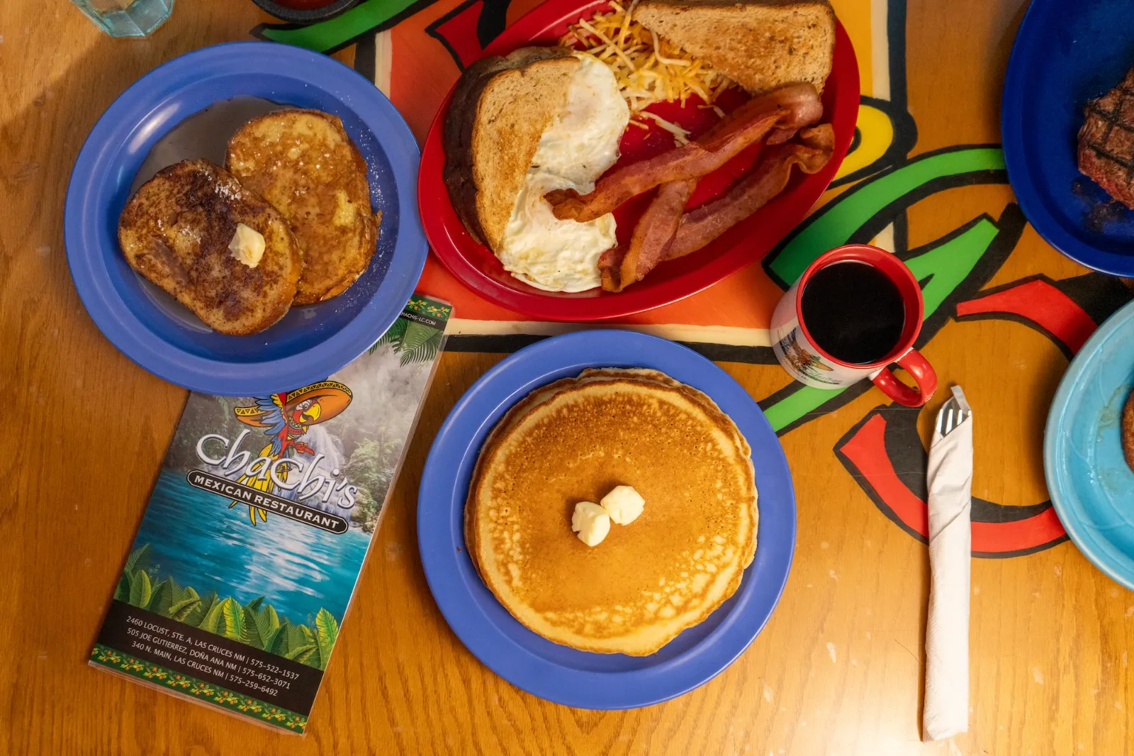 Pancakes, french toast and bacon breakfast spread