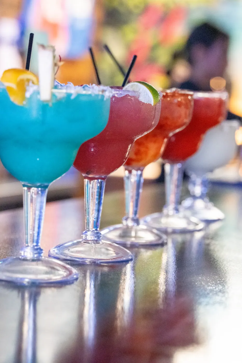 Row of colorful margaritas at the bar